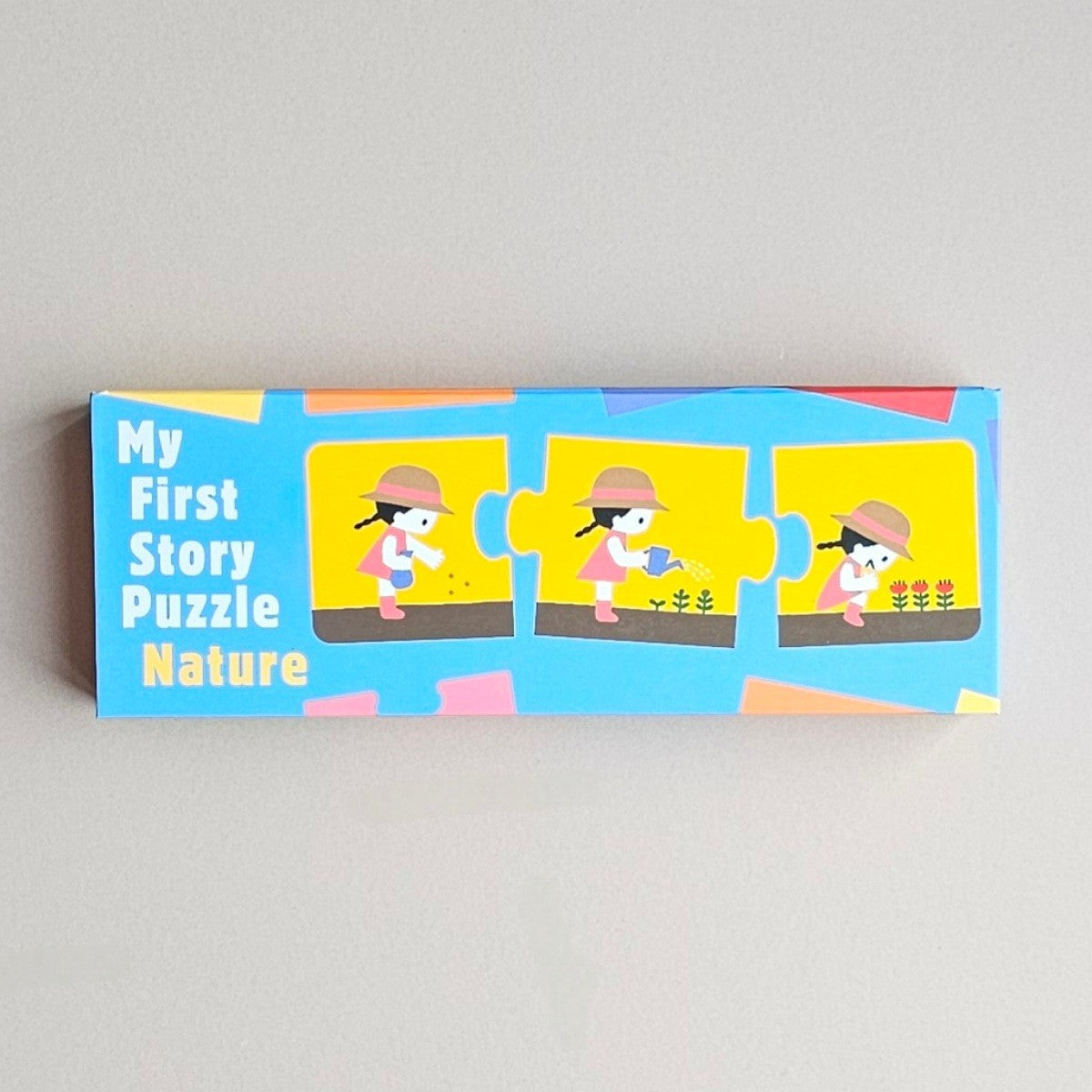 Children's jigsaw puzzle box titled 'My First Story Puzzle Nature' on a grey background