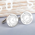 Round silver cufflinks with engraved clock face design on a light background, each cuff link showing a time and text at the top and bottom with 'Your Message'.