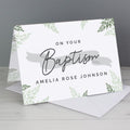 Greeting card with 'On Your Baptism' text and decorative elements on a gray background