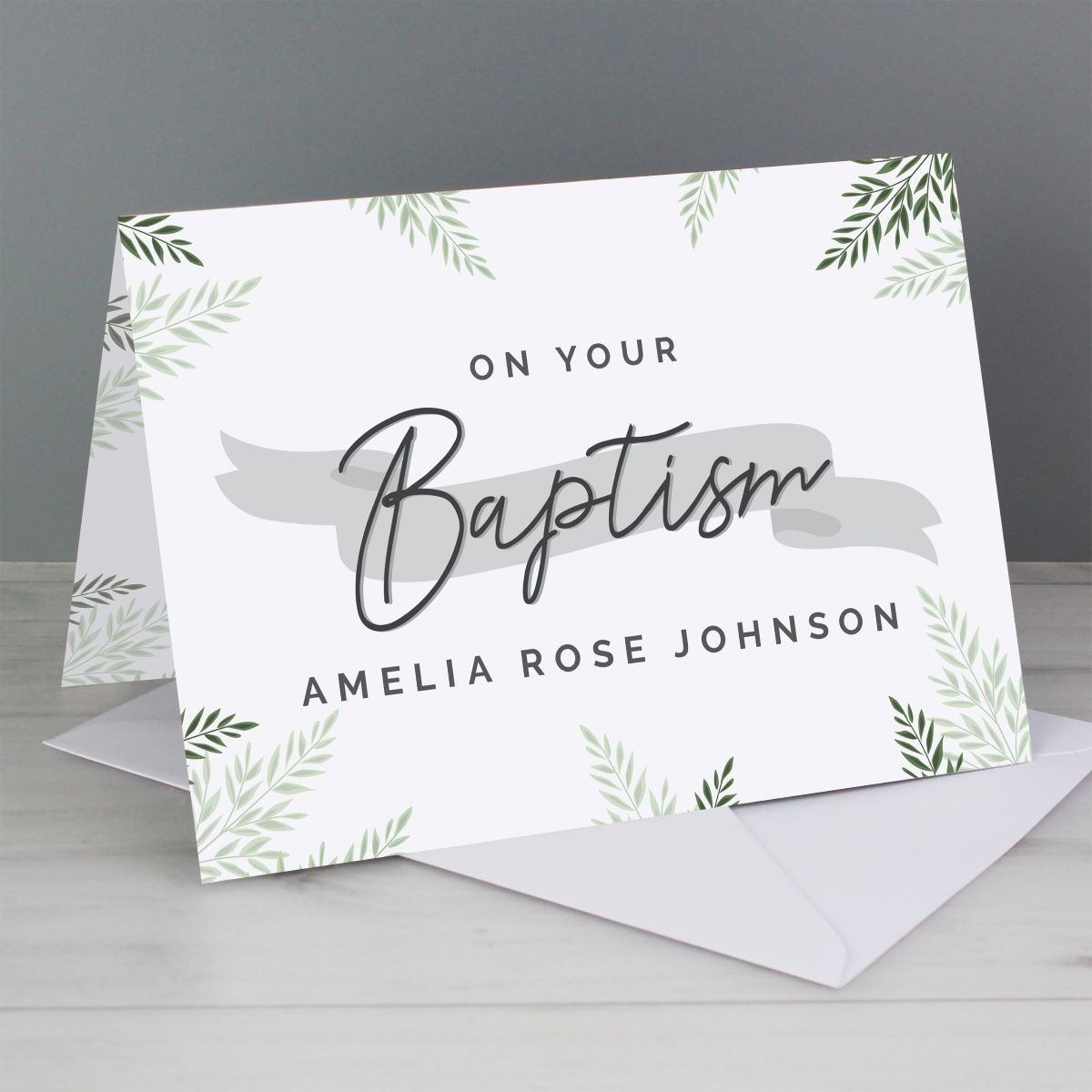 Greeting card with 'On Your Baptism' text and decorative elements on a gray background