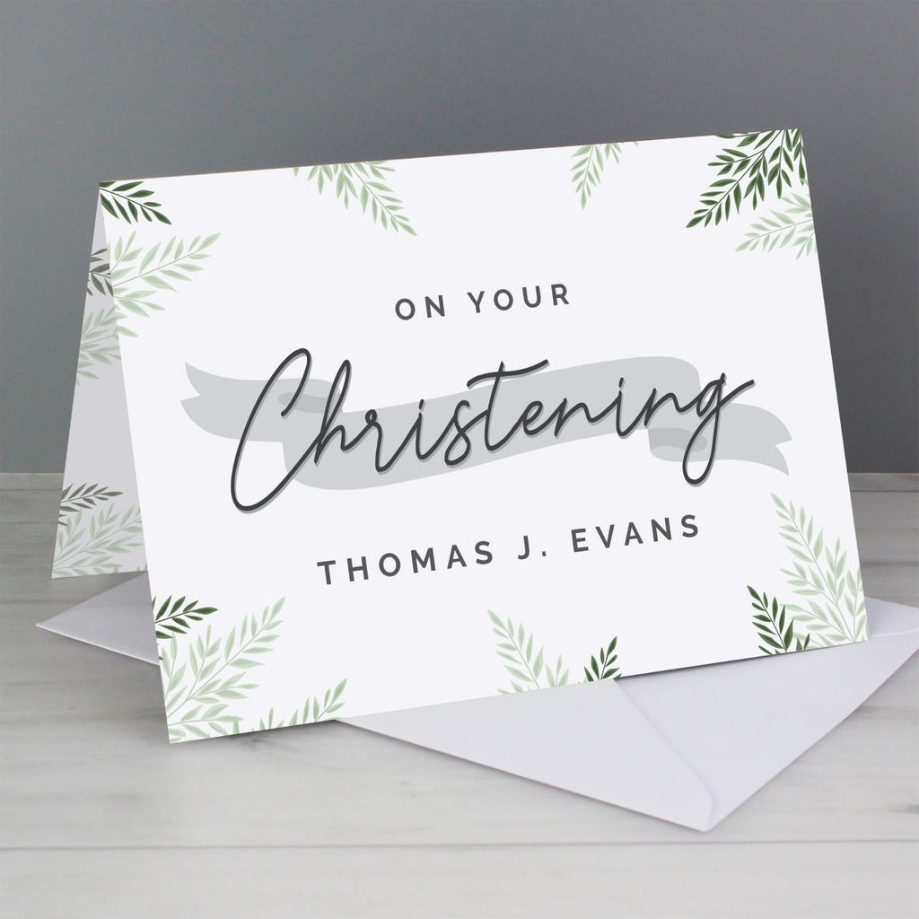 Greeting card with 'On Your Christening' text and leaf patterns on a gray background
