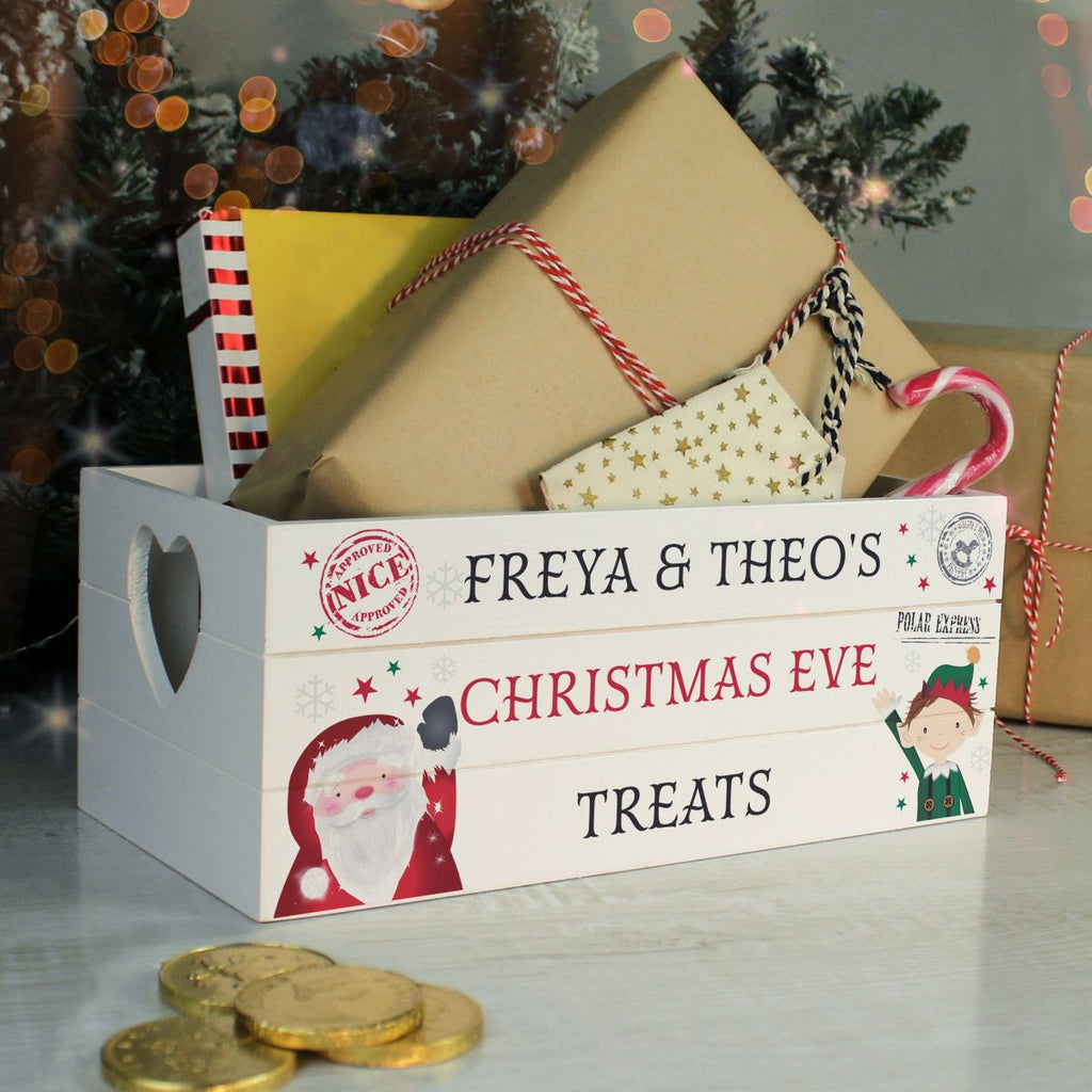 Christmas Eve treat box with presents and gold coins on a festive background