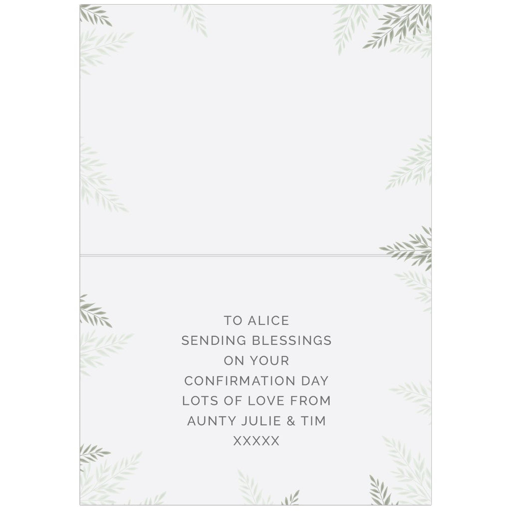 A personalized confirmation card with a white background, delicate gray-green leaf illustrations in the corners, and a centered printed message: 'TO ALINEA Sending Blessings on your Confirmation Day Lots of Love from Aunty Julie & Tim XXXXX'.