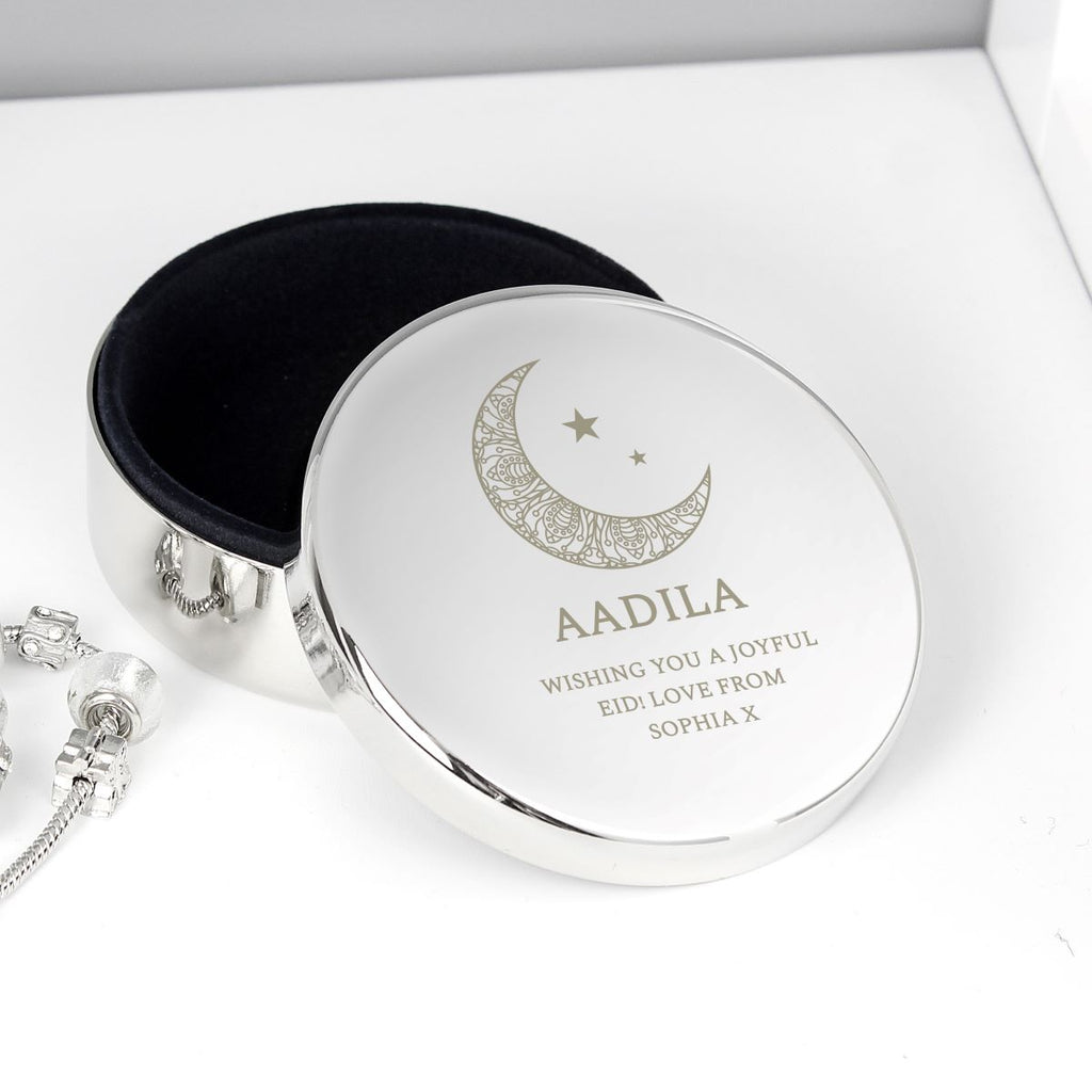 Silver jewelry box with engraved message on a white background
