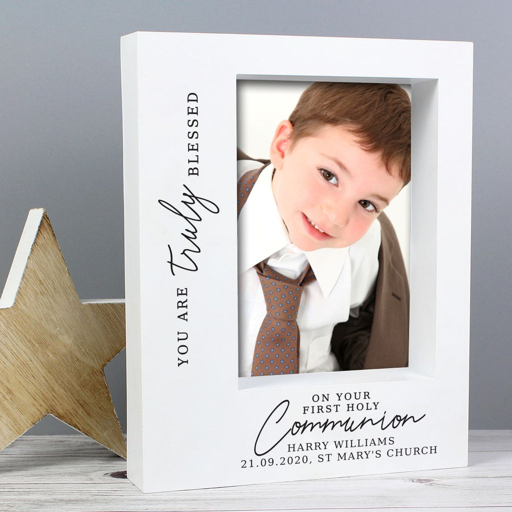Personalized photo frame with a young boy's picture and engraved text on a gray background.