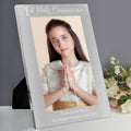 Personalized photo frame with a young girl's portrait and text on a gray background