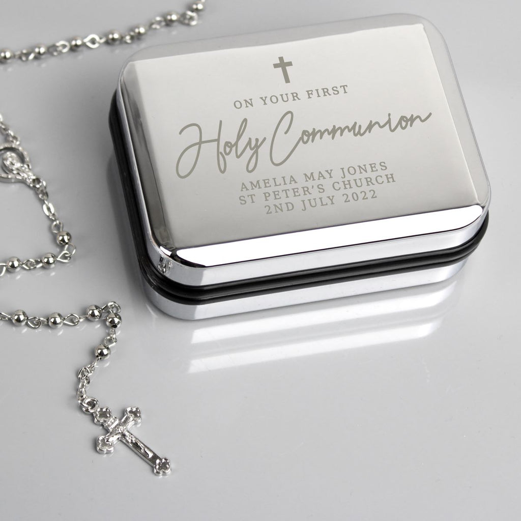 Silver jewelry box with engraved text and a matching necklace on a light gray background