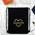 Black drawstring bag with 'SOPHIE' in a heart shape on a tiled floor.