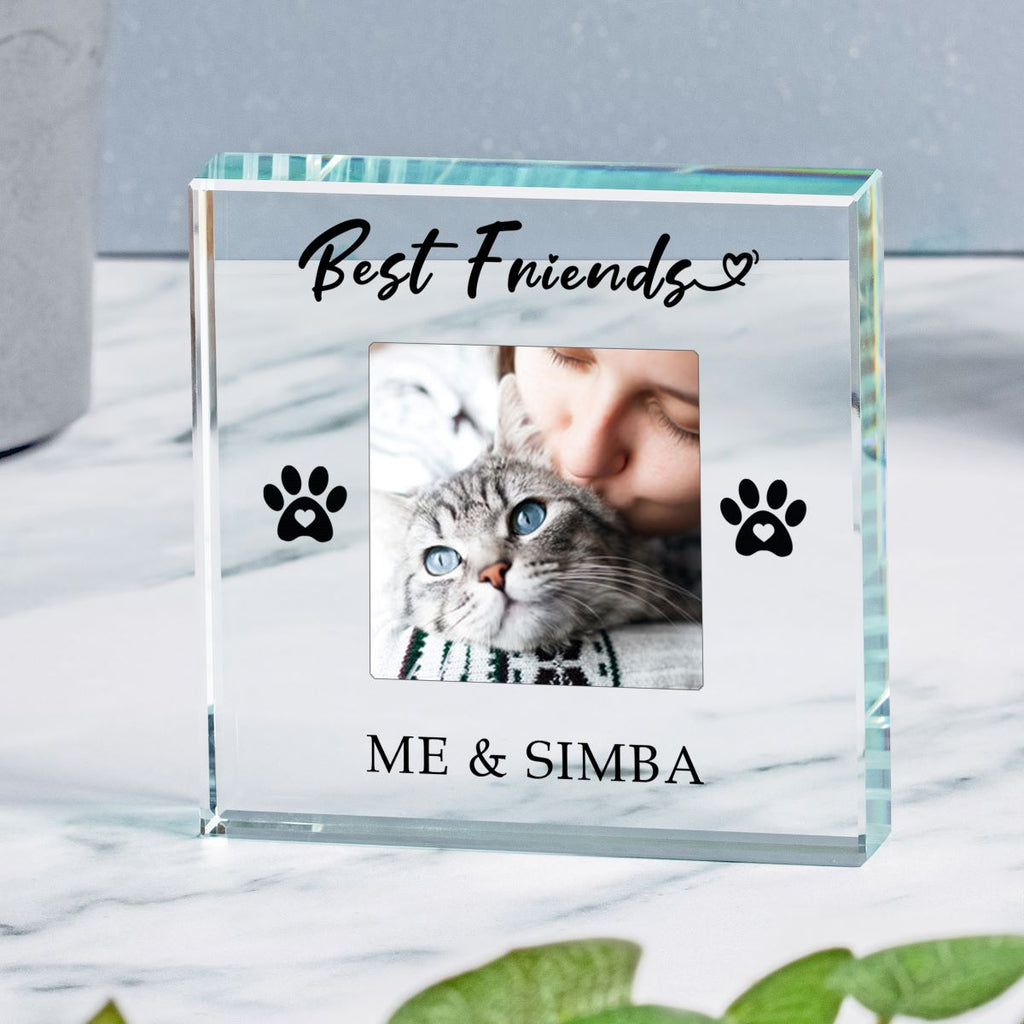 A clear glass  keepsake plaque engraved with 'Best Friends' and 'ME & SIMBA' with black paw prints, featuring a custom photo of a cat and lady, displayed on a marble surface.