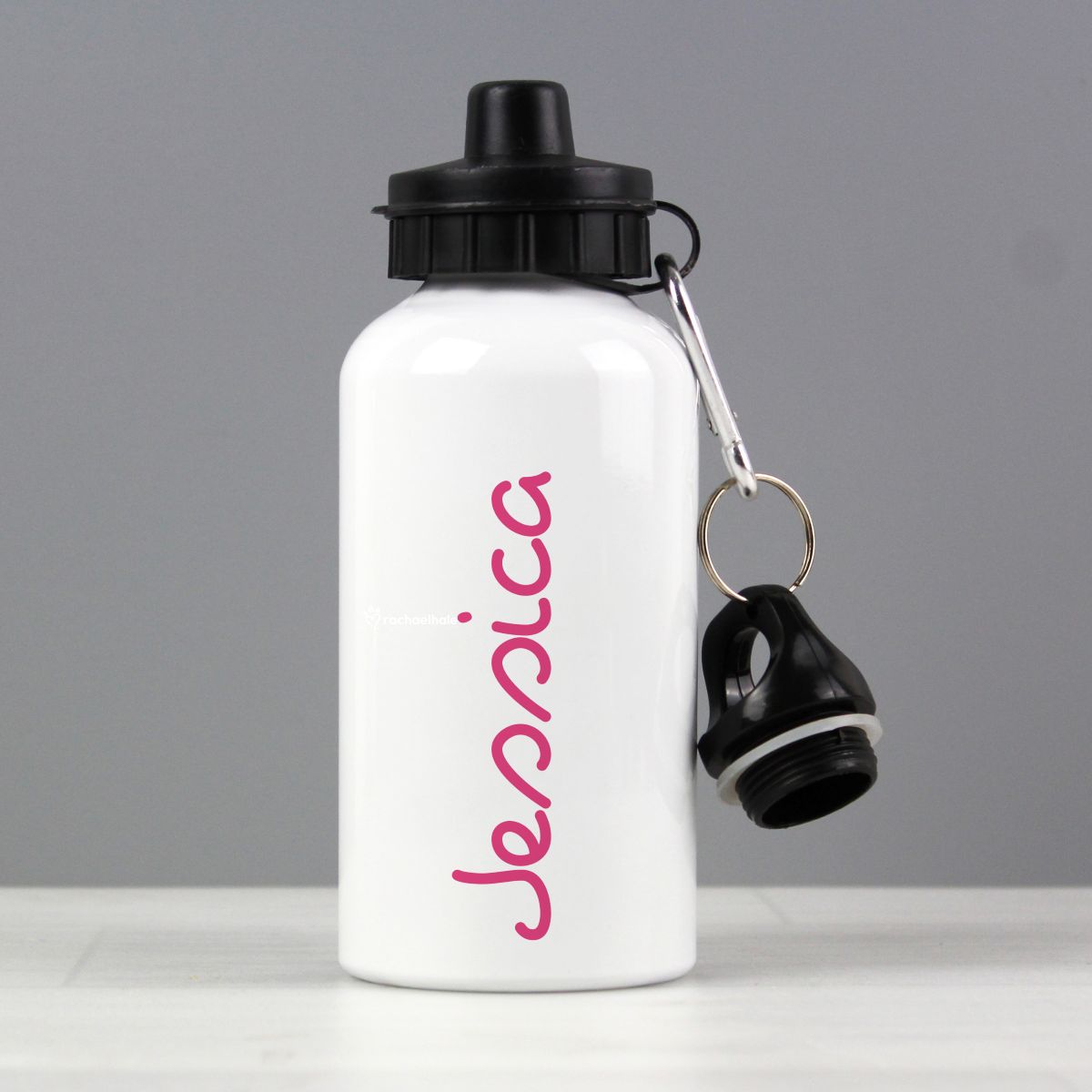 White water bottle with black cap and pink name on a gray background