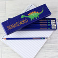 Pencil set with 'Alexosaurus' design on a notebook