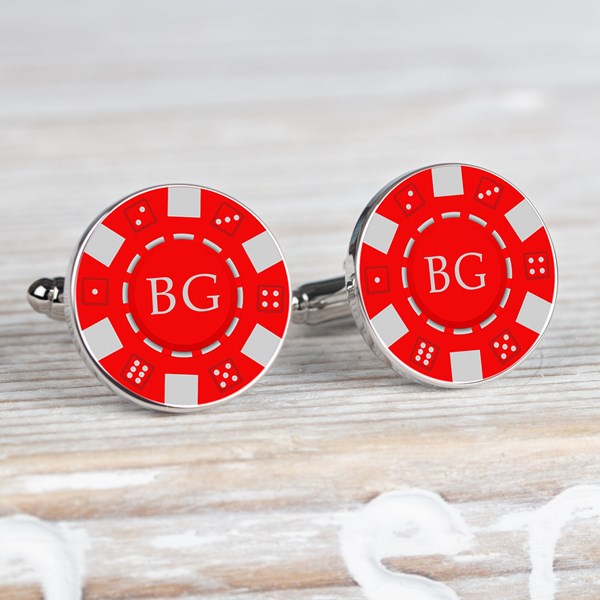 A pair of round silver-toned cufflinks styled like red and white casino chips. Each one has a red center white border segments, and the initials 'BG' in white.