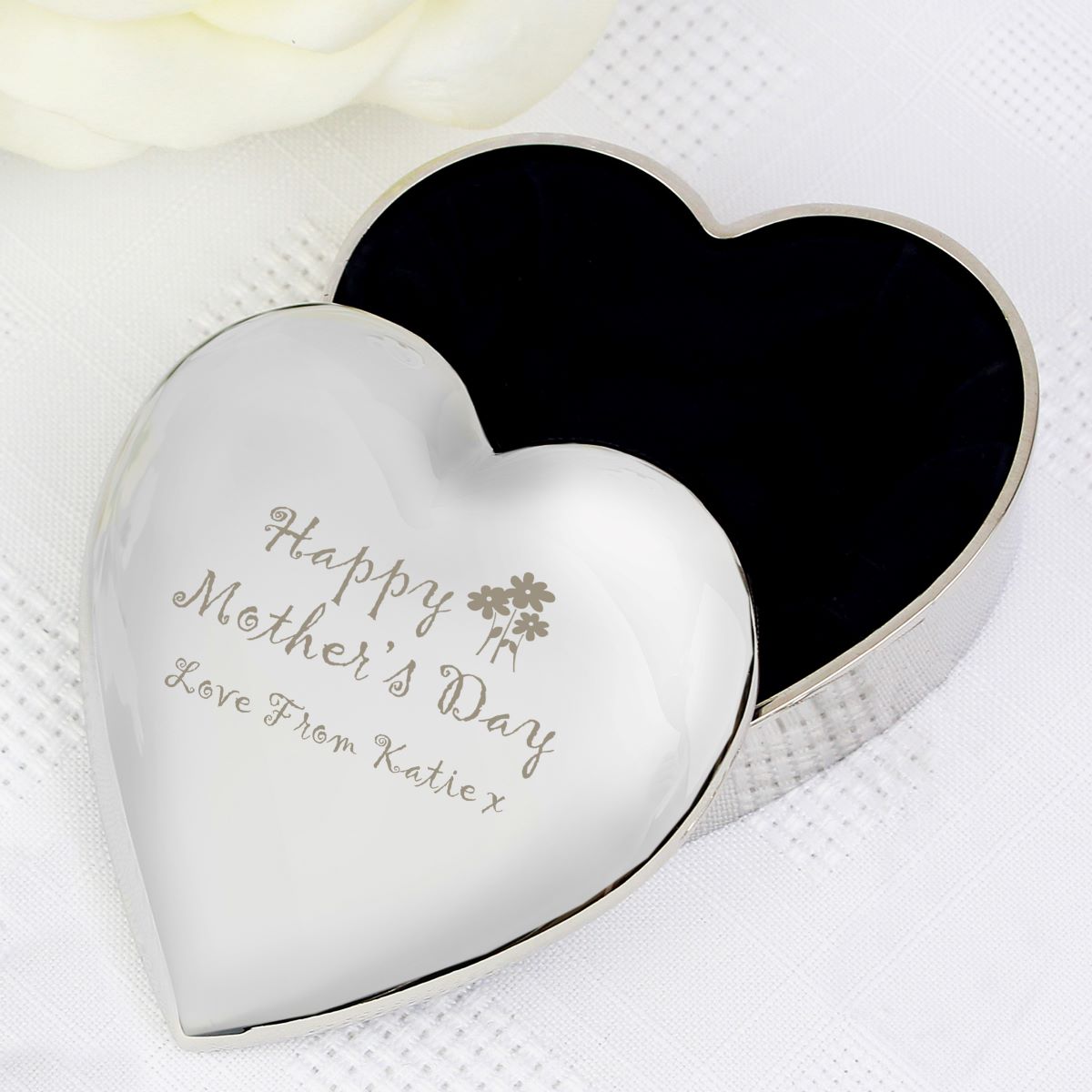 Heart-shaped silver box with 'Happy Mother's Day' engraving on a white background