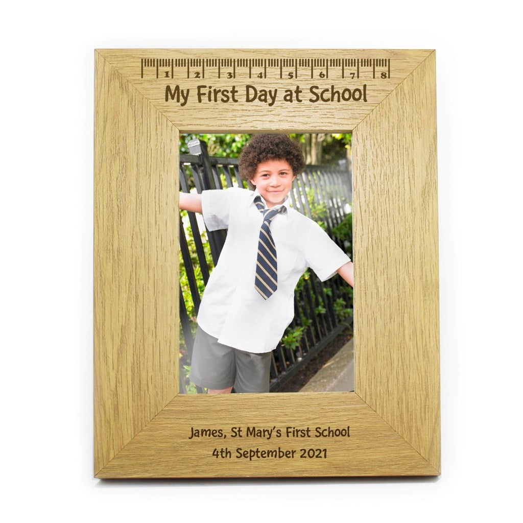 Wooden photo frame with 'My First Day at School' text, displaying a photo of a child in a school uniform.