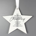 White star-shaped ornament with text on a gray background