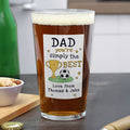 Pint glass with a personalized label for Dad on a kitchen counter.