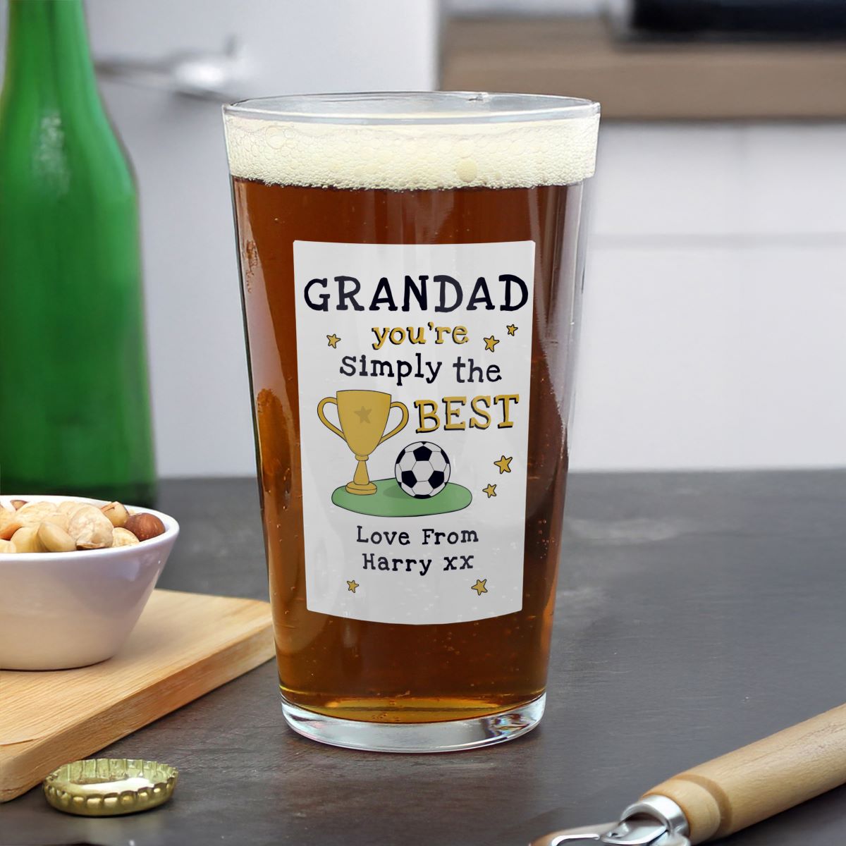 Pint glass with a personalized message on a kitchen counter