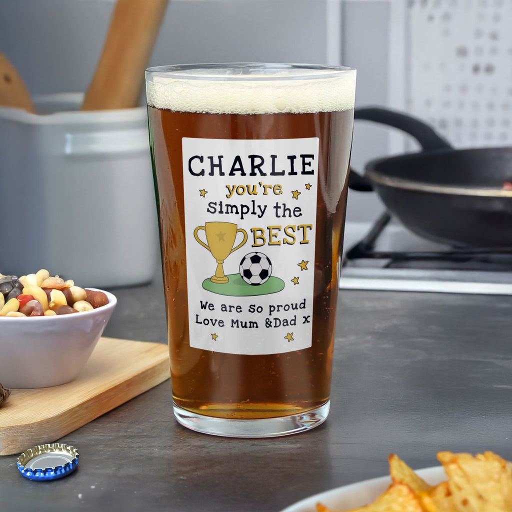 Pint glass with a personalized label on a kitchen counter