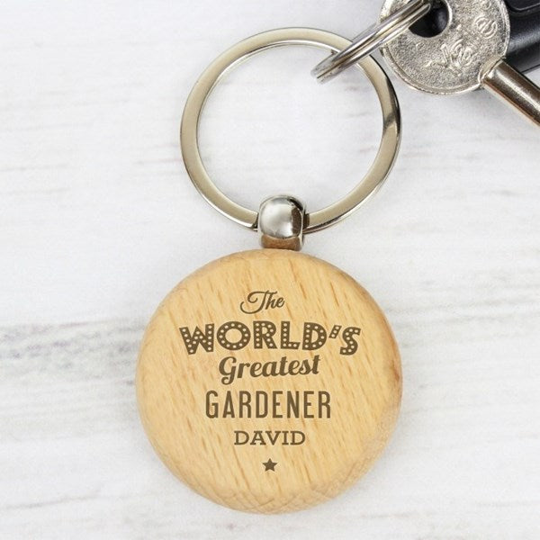 Wooden keychain with engraved text on a white background
