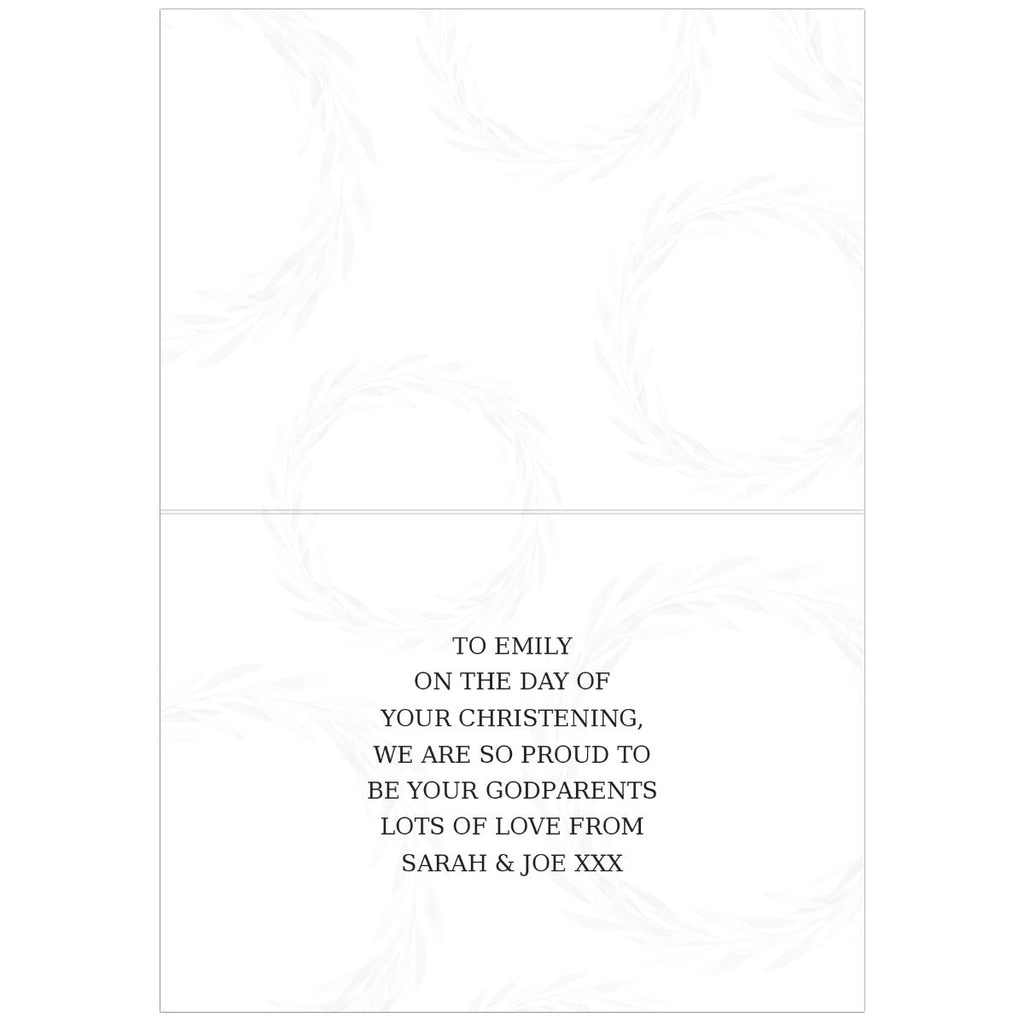 A white card with a faint floral wreath pattern on the front and a printed christening message on the back, shown against a white background.