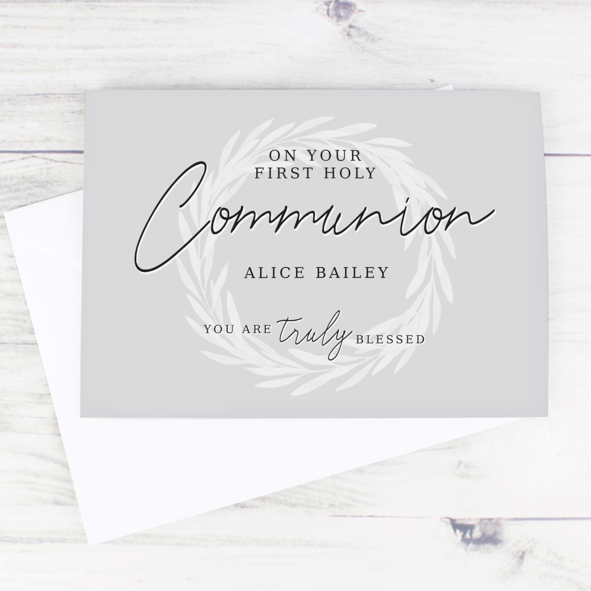 Greeting card for First Holy Communion with personalized text on a white background