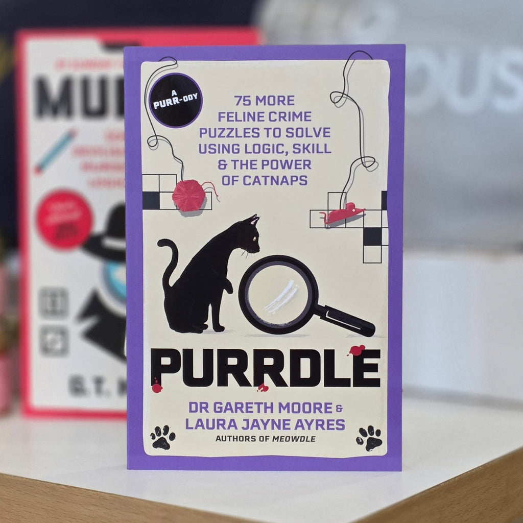 The book cover of 'Purrdle' by Dr Gareth Moore and Laura Jayne Ayres, featuring a purple border, a black cat silhouette, a magnifying glass, and a cream background with puzzle illustrations.