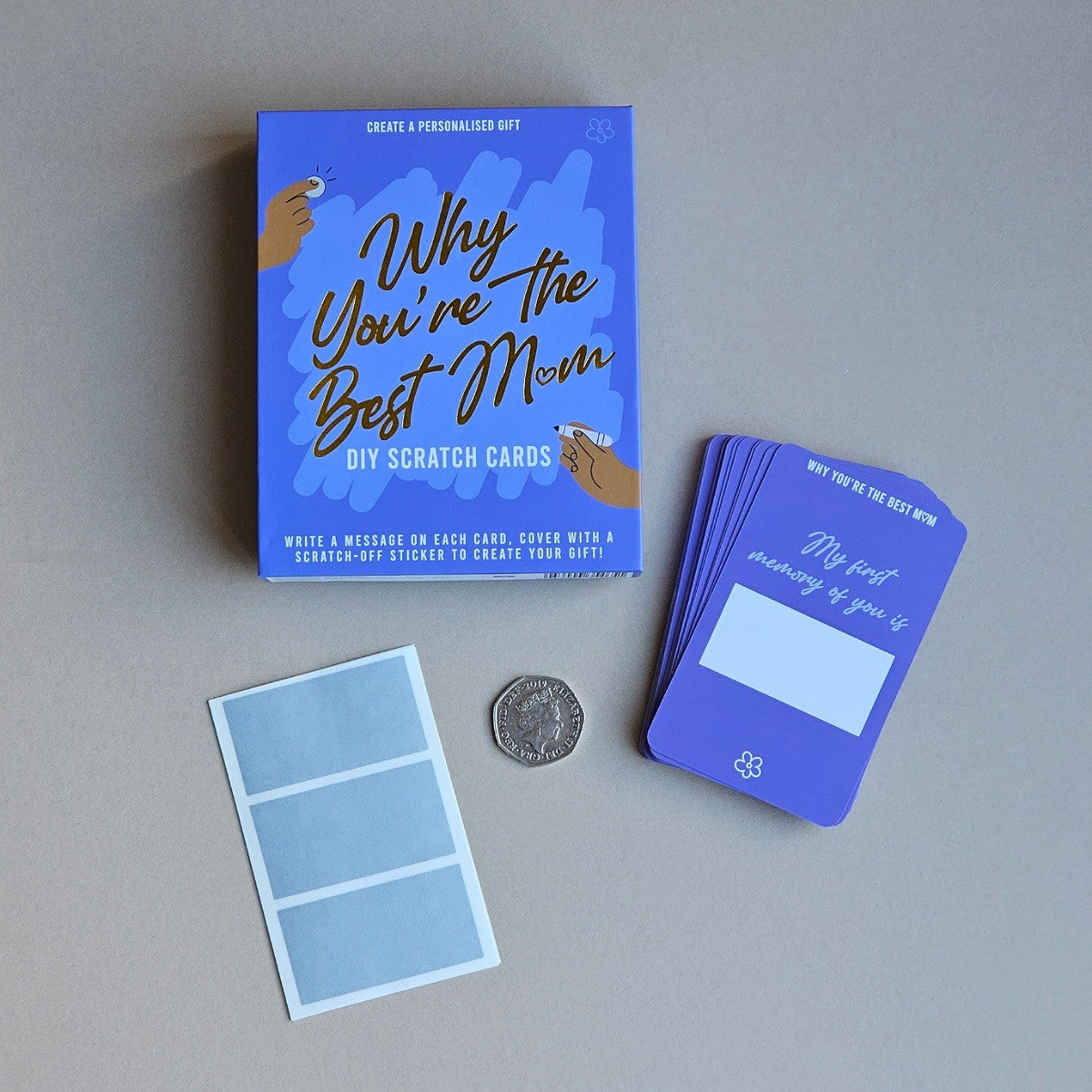 Blue scratch cards with 'Why You're the Best Mom' text on a gray surface
