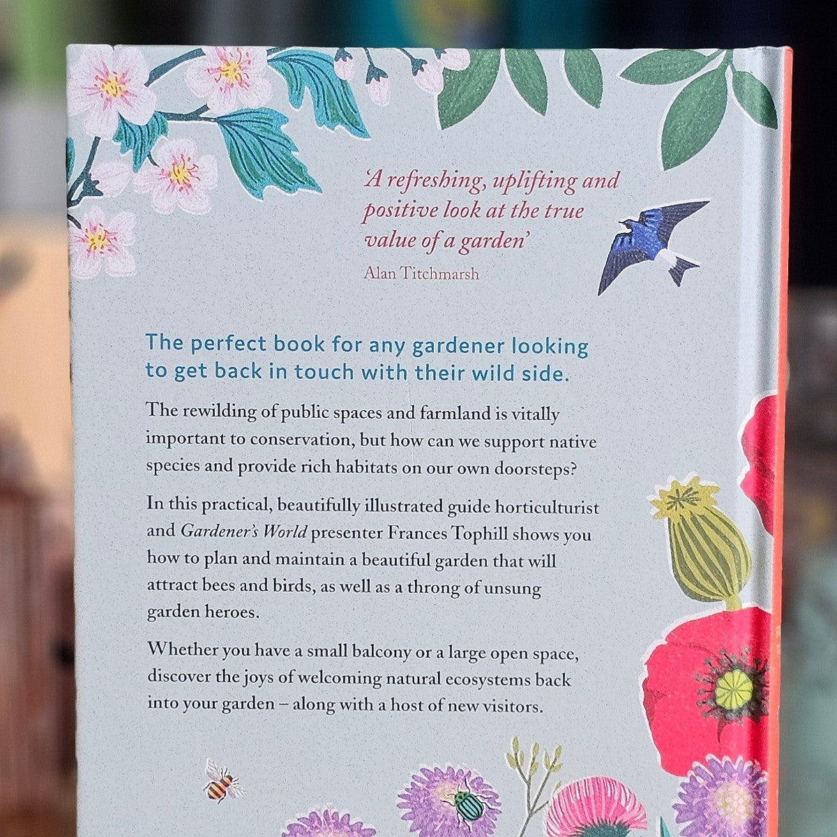 Back book cover with floral design and text about gardening and nature conservation.