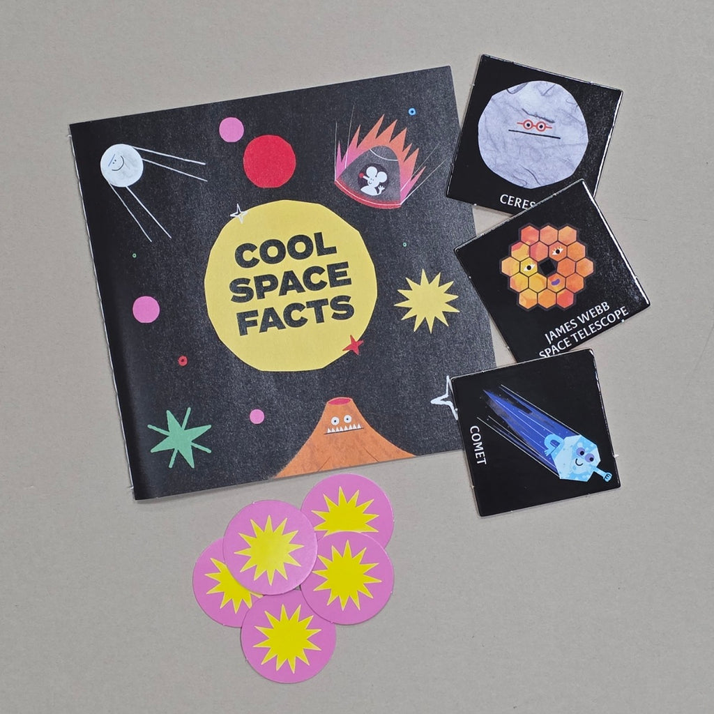 Educational space-themed book with stickers on a grey background