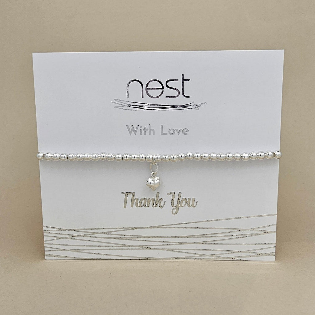 Bracelet on a 'nest' branded card with 'Thank You' text on a beige background