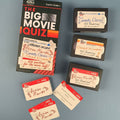 Collection of 'The Big Movie Quiz' video cassettes and cards on a blue background