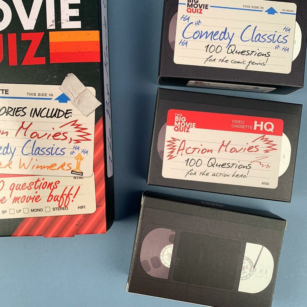 Question VHS tapes with movie-themed labels on a blue background