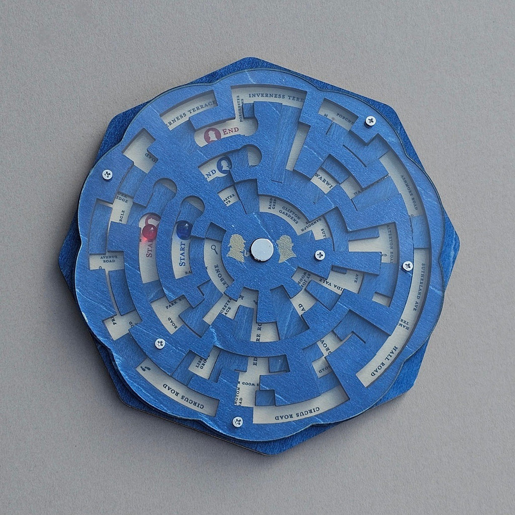 Blue mechanical puzzle with circular design on a grey background