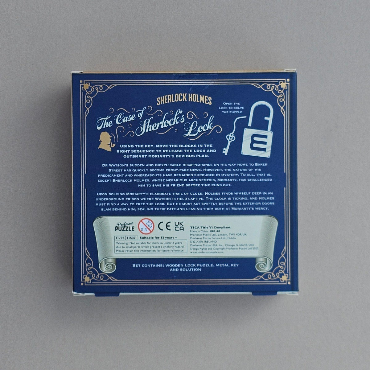 Back of blue box with Sherlock Holmes puzzle design with information on a grey background