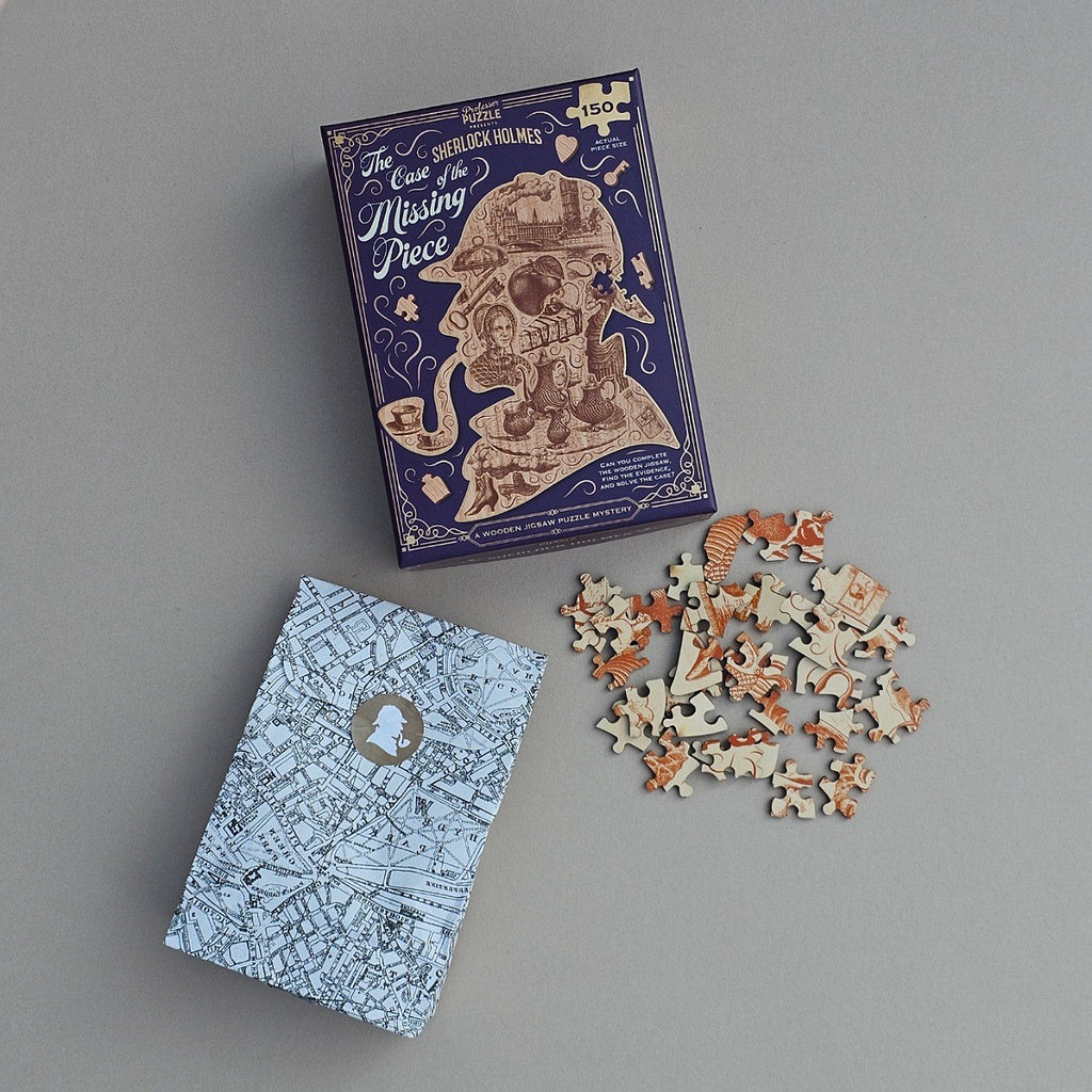 Sherlock Holmes puzzle set with packaging and jigsaw pieces on a grey background