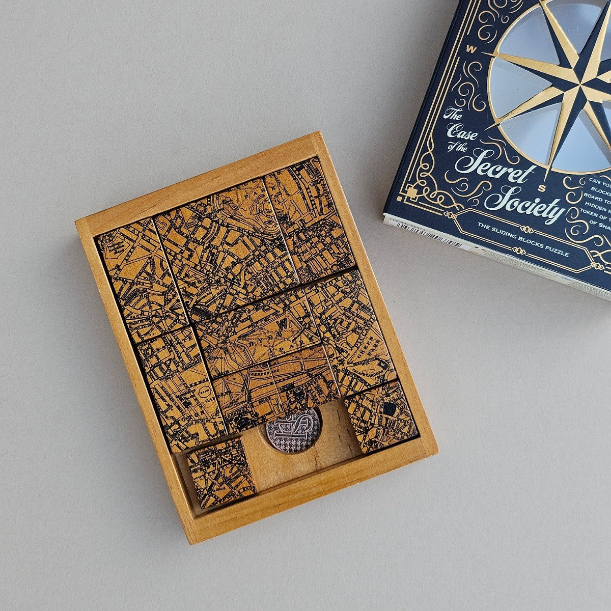 Wooden box with intricate design on a grey surface