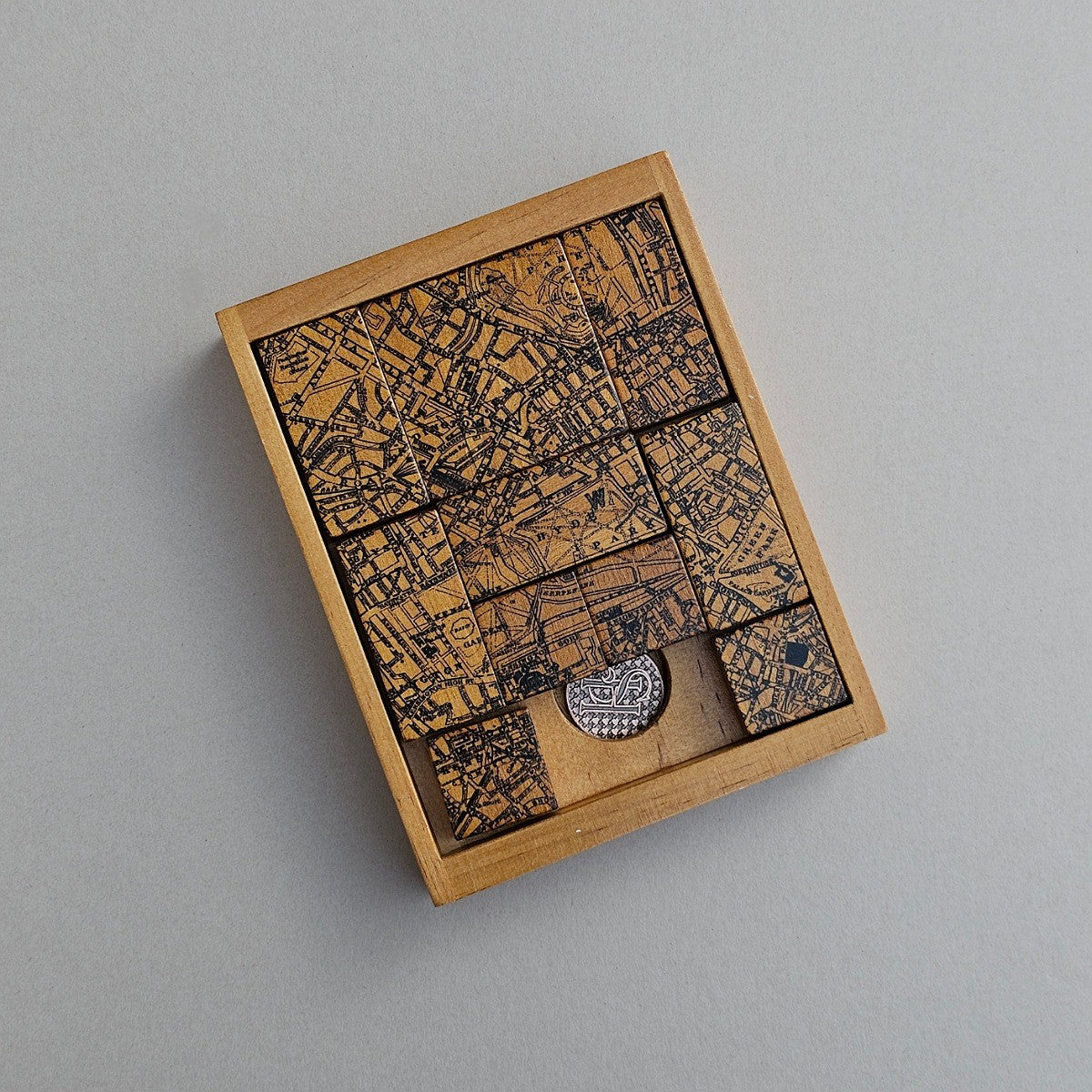 Wooden block set with map design on a grey background