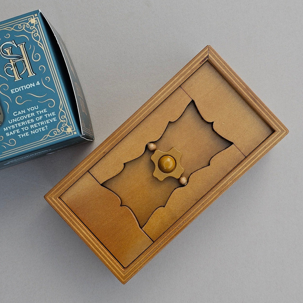 Brown puzzle box with decorative elements on a grey background