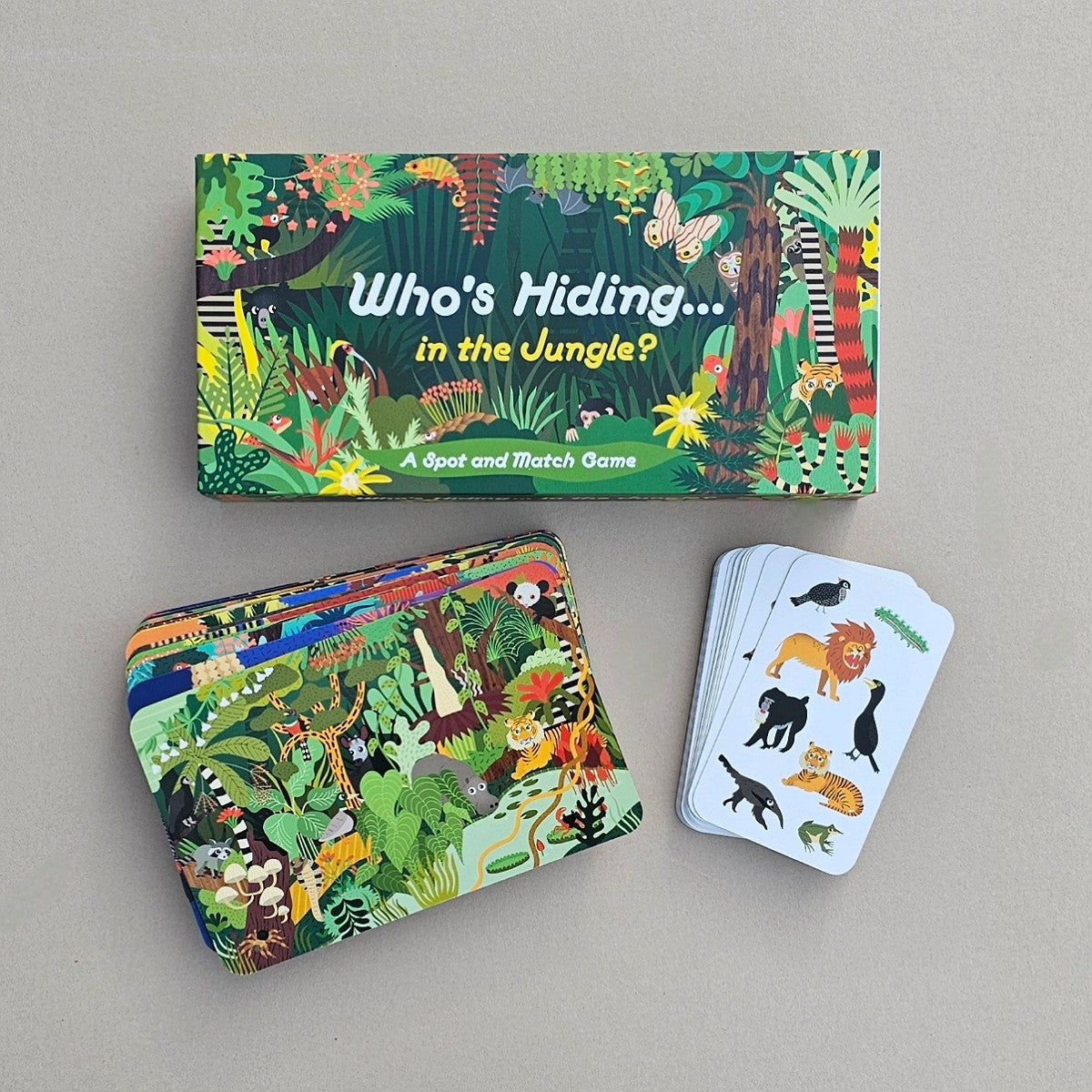 Children's educational game set with 'Who's Hiding in the Jungle?' theme on a grey background