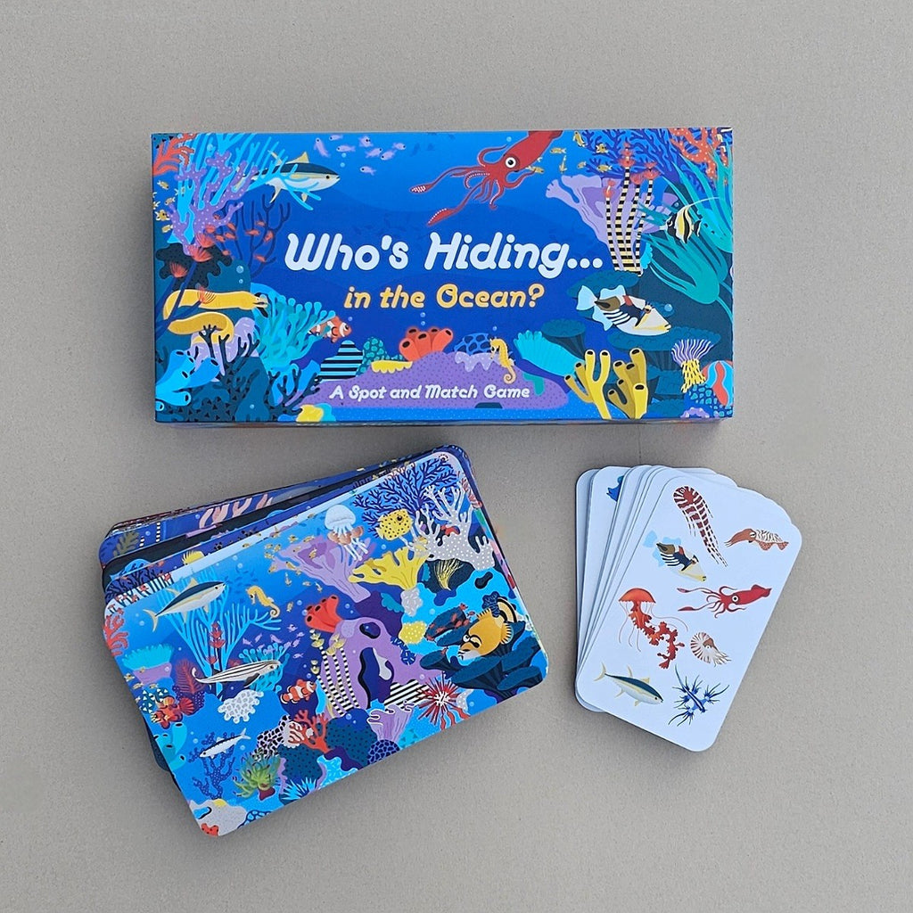 Children's educational game set with 'Who's Hiding in the Ocean?' theme on a grey background